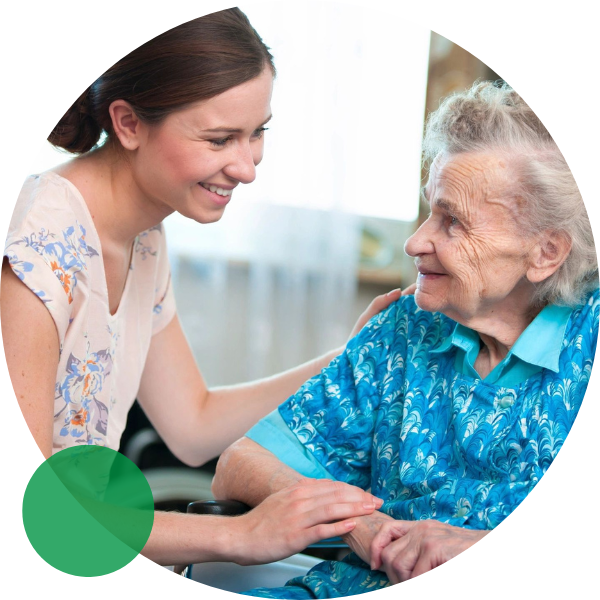 A senior woman is being taken care of by a young woman